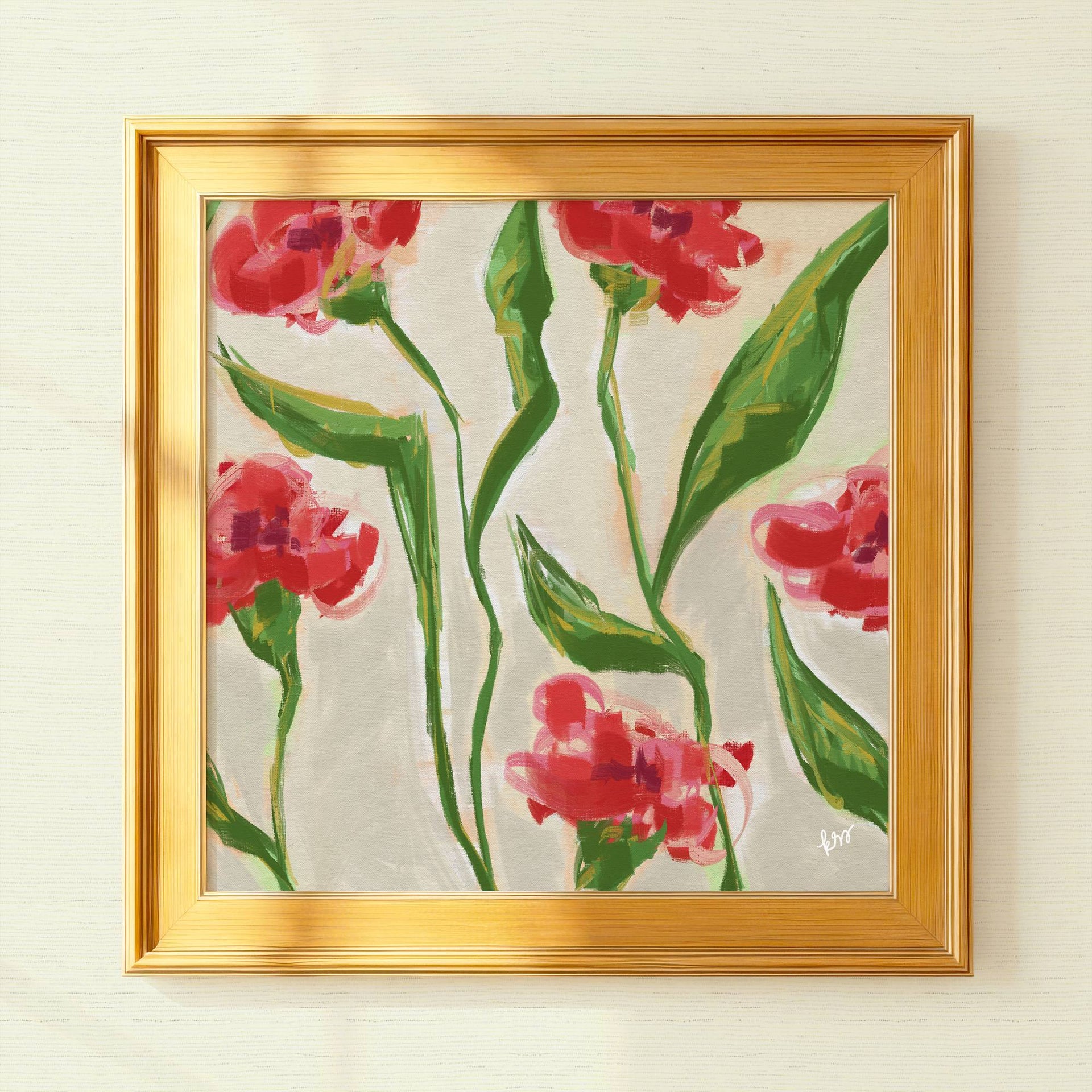 The image is a framed painting of red flowers with green leaves, displayed on a white wall.