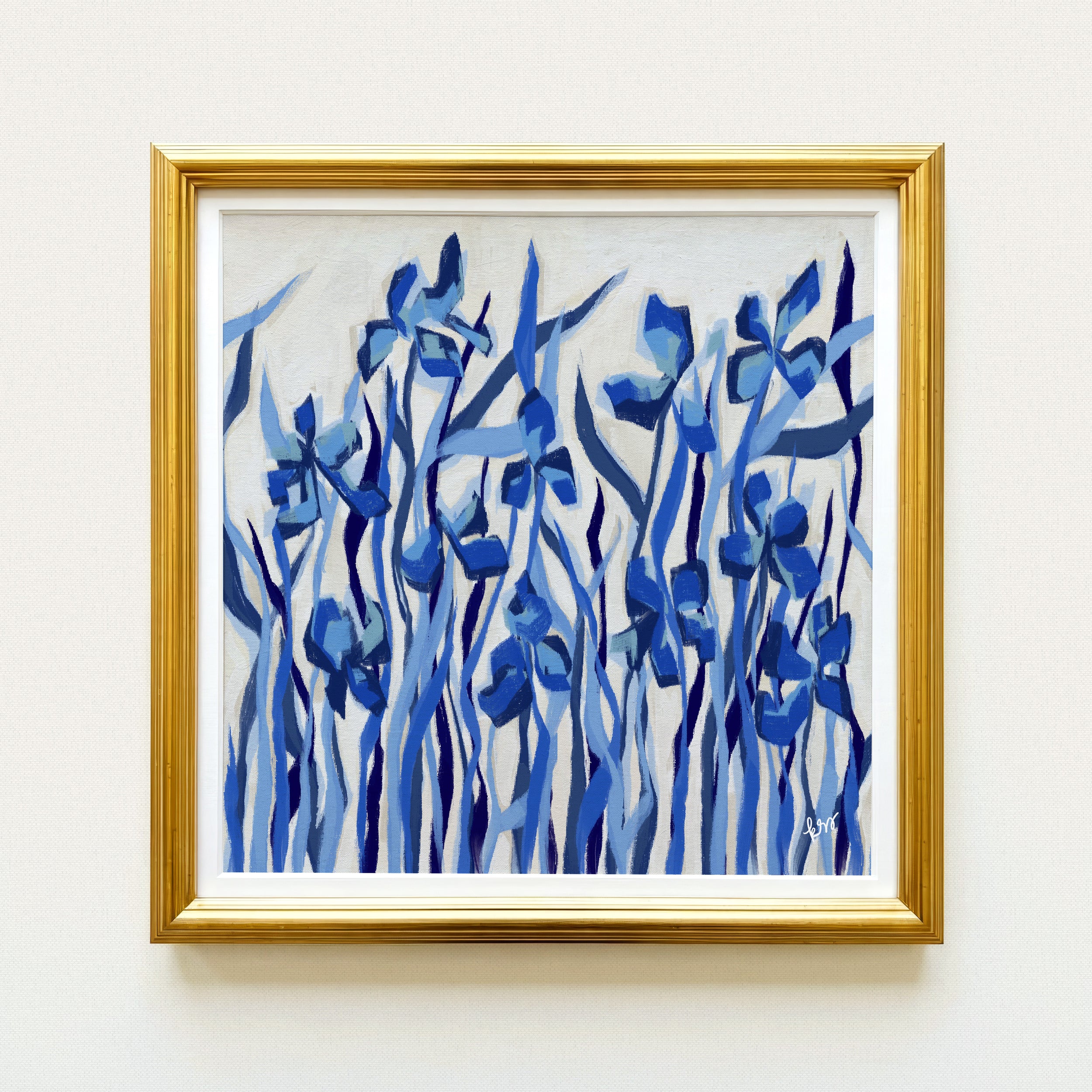 The image is a framed painting of blue flowers.