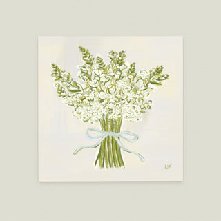 A bouquet of white flowers tied together with a blue ribbon.