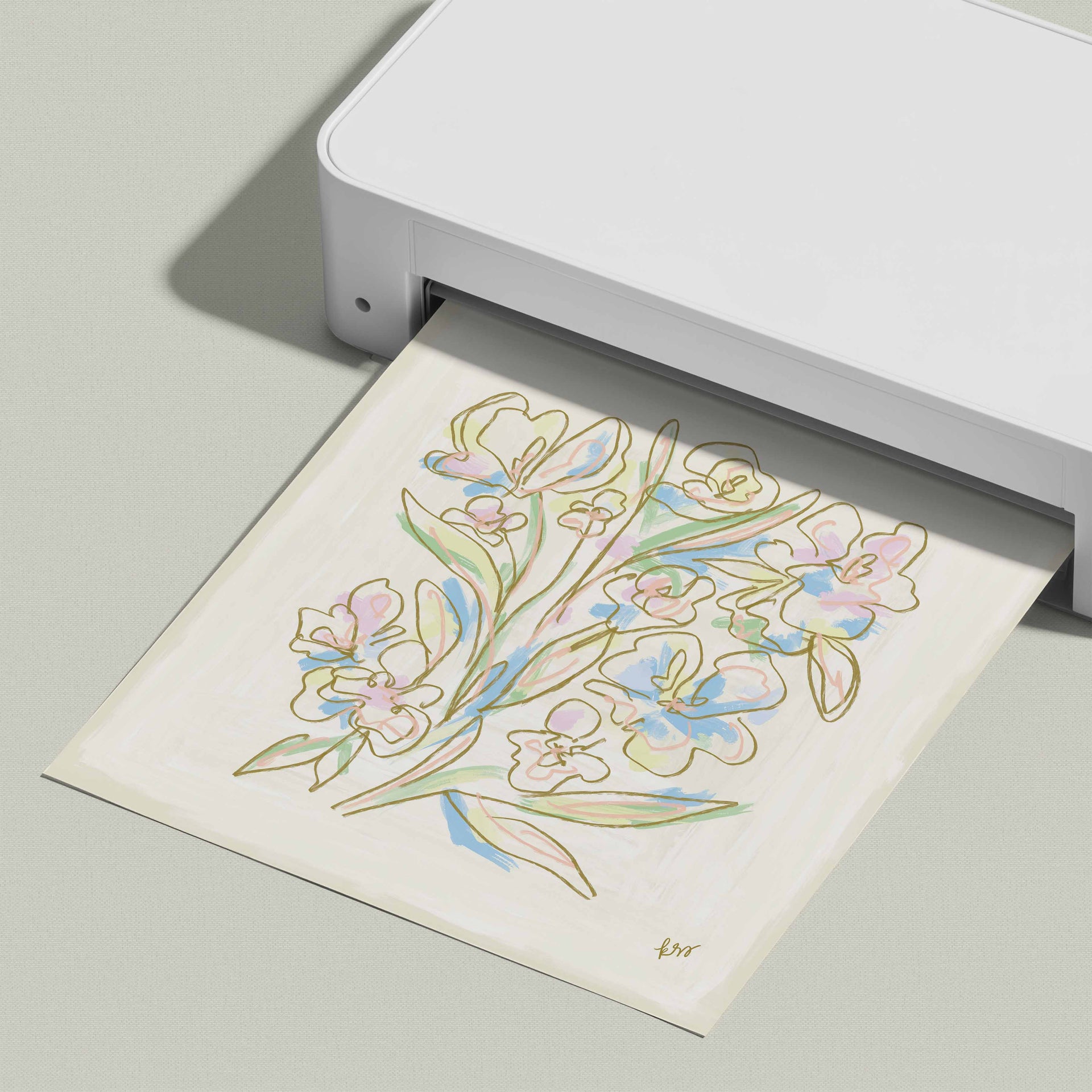 A white printer is printing a colorful illustration of flowers on a piece of paper.