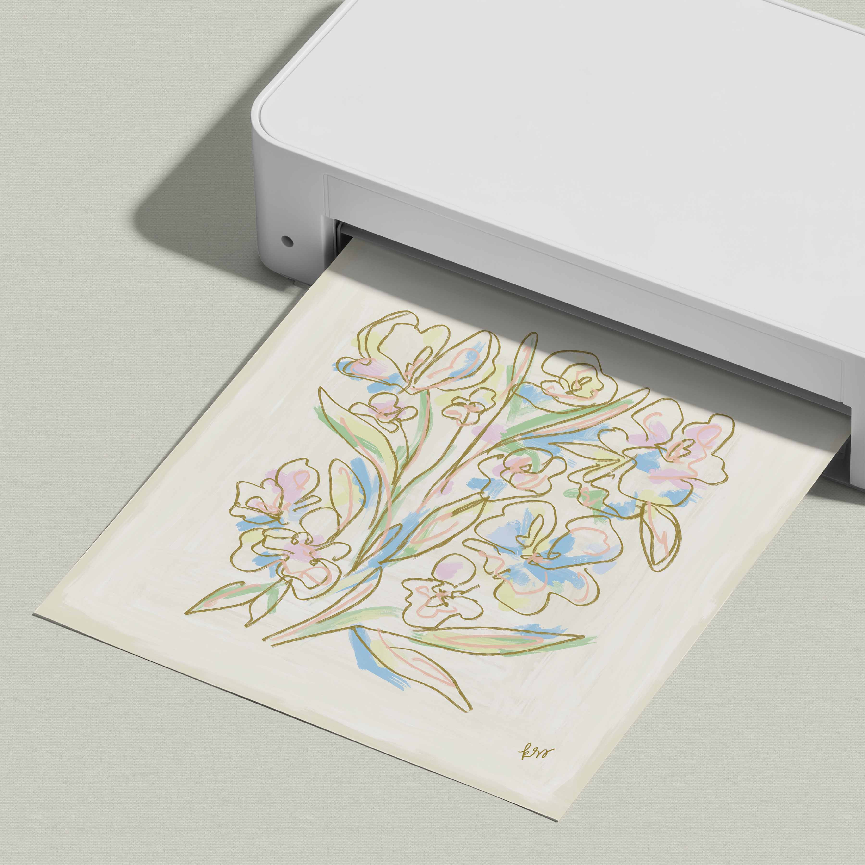 A white printer is printing a colorful illustration of flowers on a piece of paper.