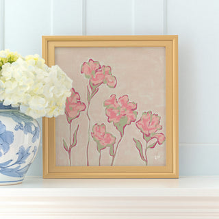 a framed painting of pink flowers on a white shelf, accompanied by a vase of white hydrangeas.